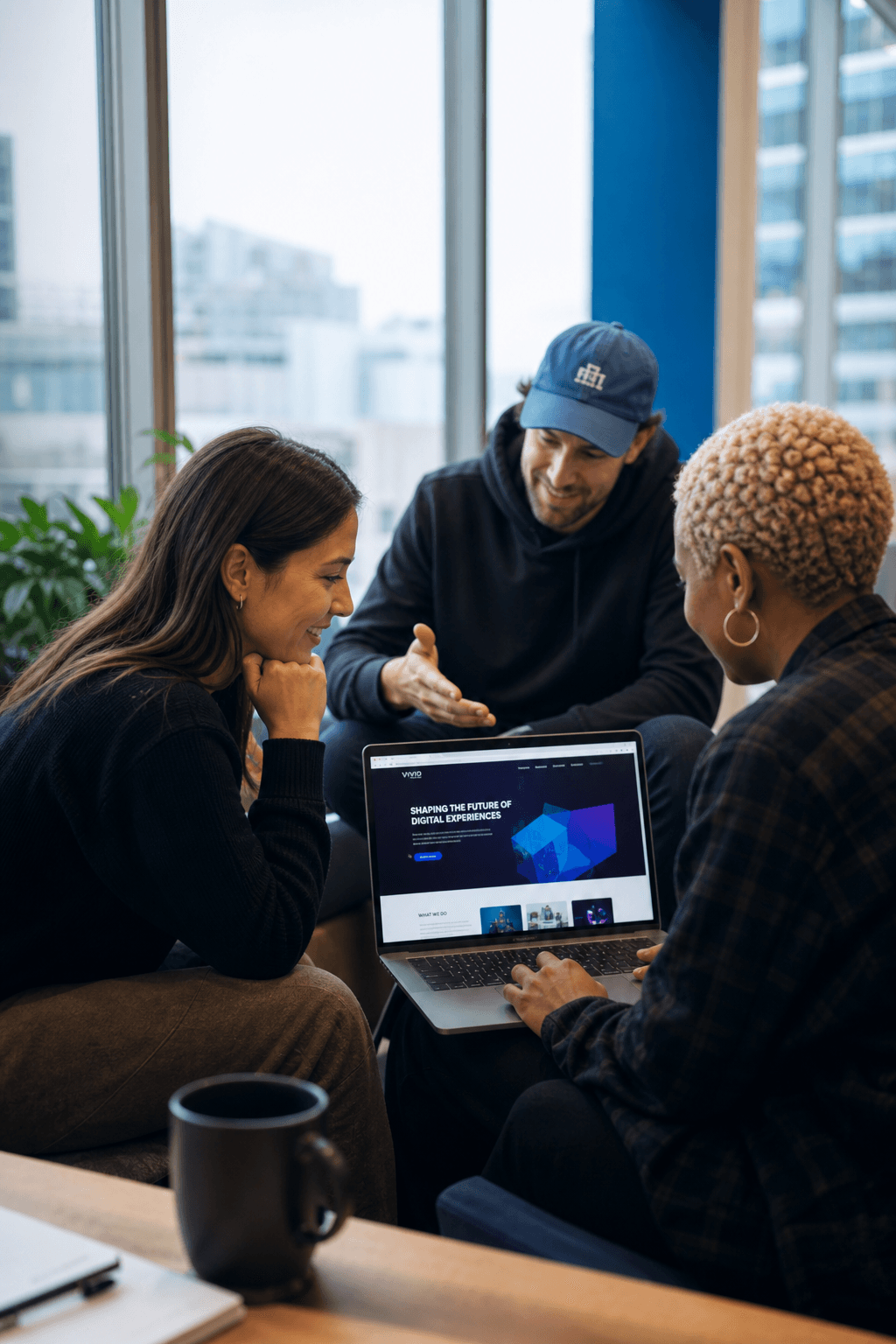 The Supiatech team reviewing a website design together